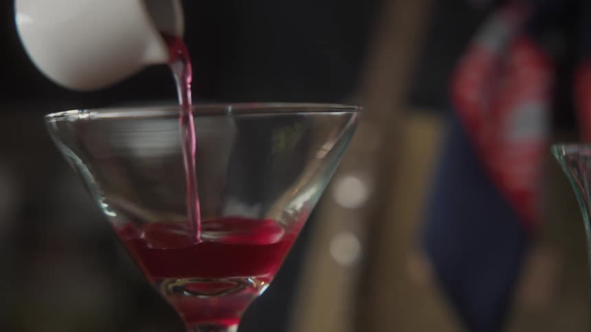 Bartender prepares a cocktail at the bar