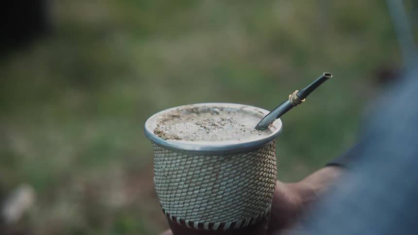 Man prepares mate tea in the countryside