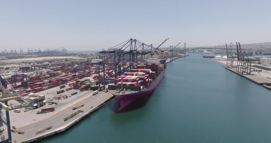 Skyline of the port area with cargo vessels anchored in the port