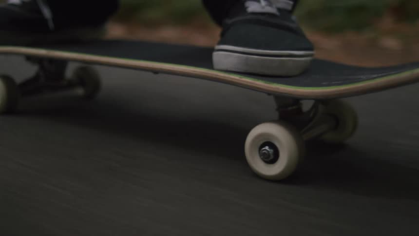 Close up of a person riding a skateboard