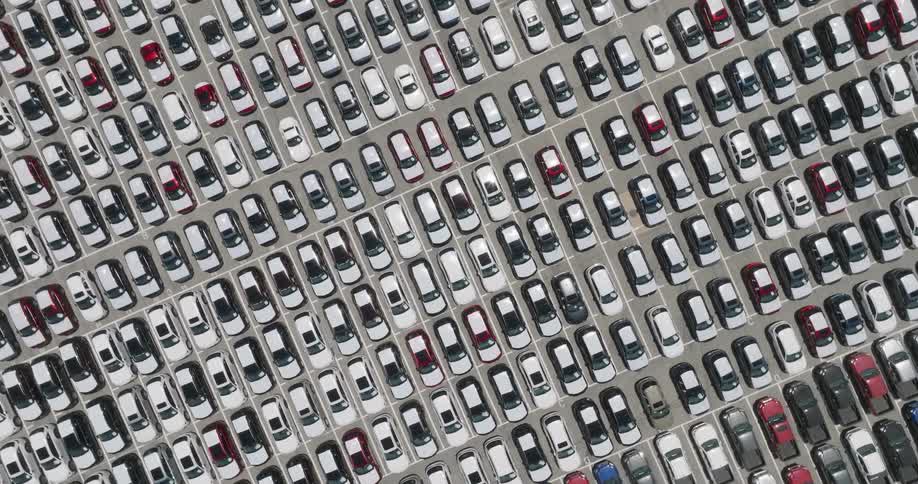 A parking lot full of cars seen from above