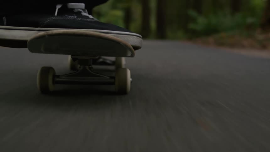 Close up of a person riding a skateboard