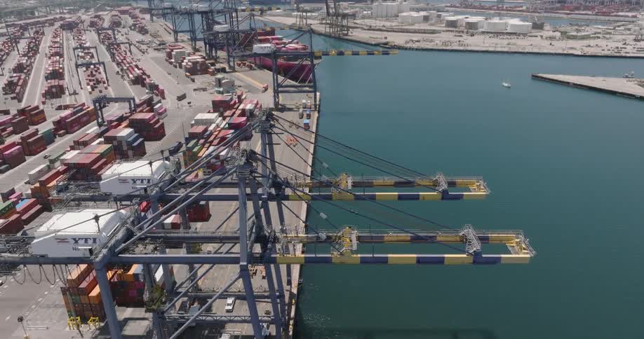 Aerial view of cranes in the container yard at the port