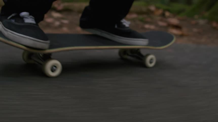 Close up of a person riding a skateboard
