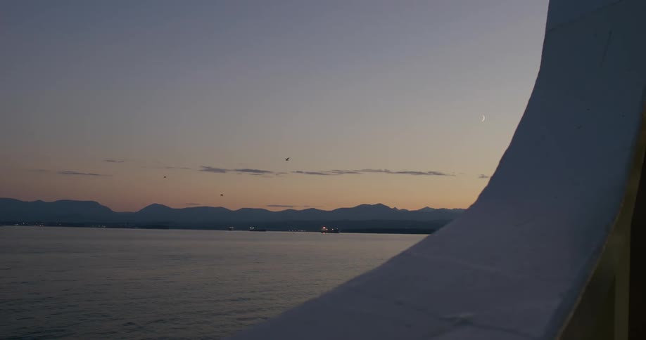 The sun is setting on the water