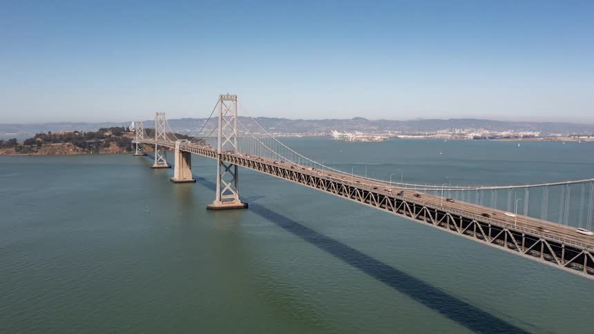 Aerial of the bridge over the sea on a sunny day