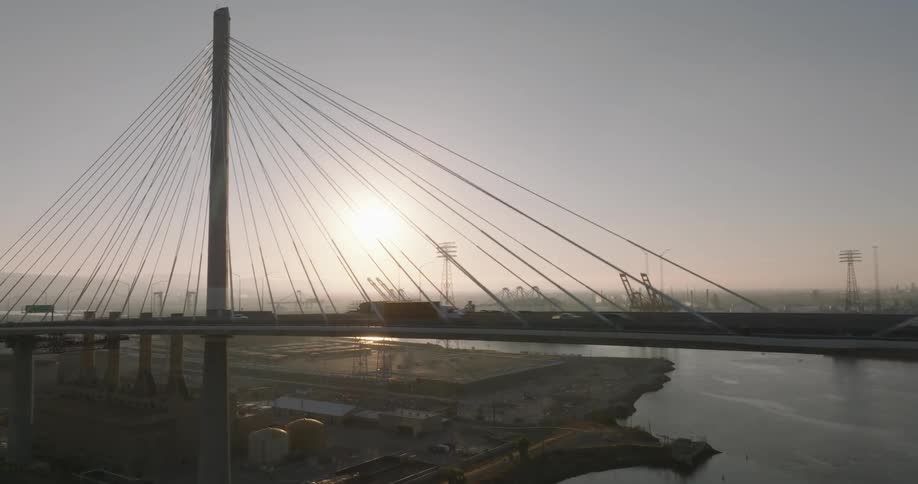 Aerial of the suspension bridge over the city and river