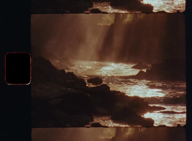 Sunlight sines over a river in the forest caught on vintage film