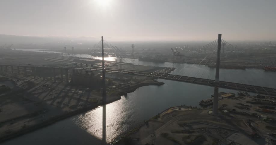 Landscape of moving cars on a bridge in a metropolitan area during the day