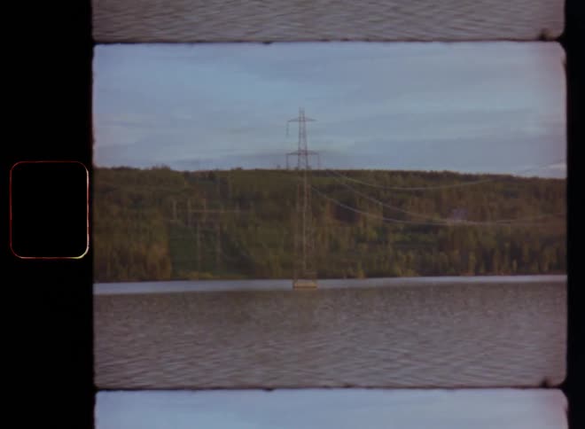 Power lines over a lake caught on vintage film