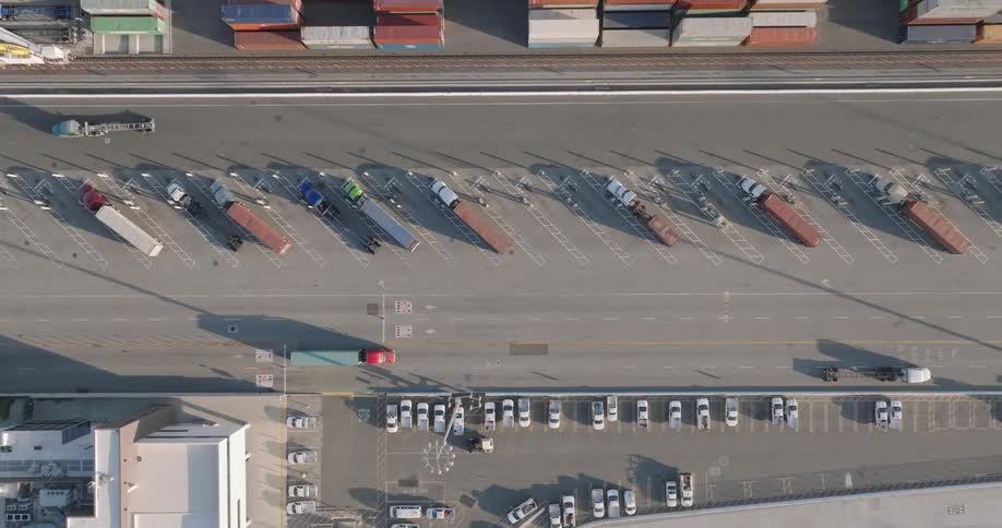 Aerial panorama of moving trucks in a logistics center