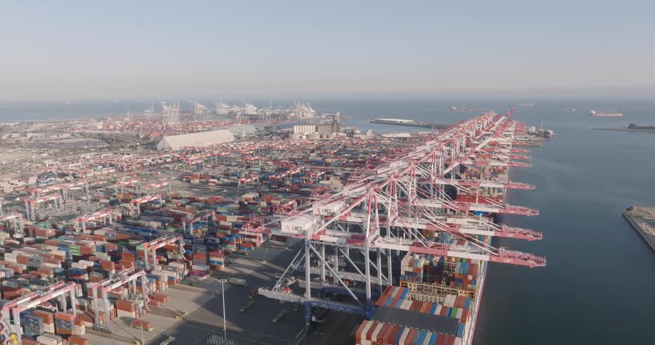 Aerial panorama of containers at a port with cargo ships docked