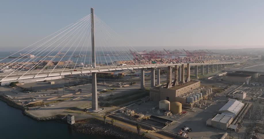 Cars and trucks travel across the new cablestayed gerald desmond bridge at the port of long beach california