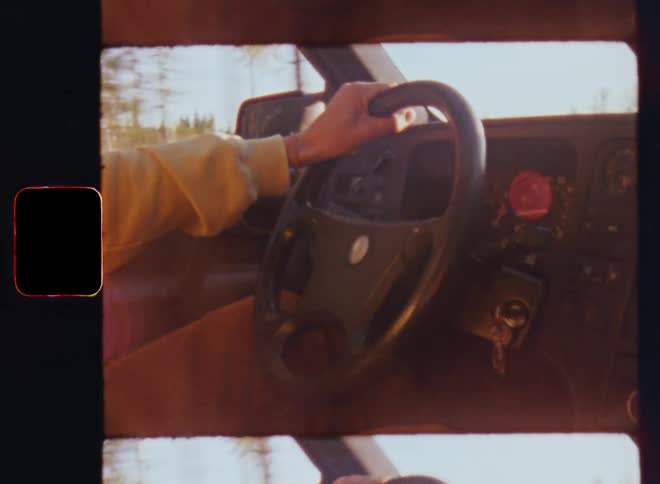 A person is steering the vehicle as he accelerates or speeds up while holding on to the steering wheel as the speed er tempo increases and the car gets faster while racing over a forest or countryside road with an old automobile or motorcar from the 1980s