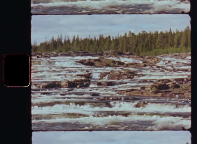 A clip of a water fall close to the woods