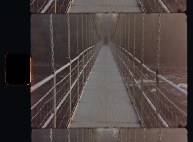 Crossing a small bridge over a river caught on vintage film