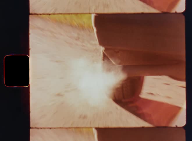 Punchy close up of the exhaust pipe of a dirty car polluting the planet while burning fossil fuels such as mineral oil diesel gasoline or petrol caught on vintage film zooming in and out in a dramatic way as symbol for environmental degradation