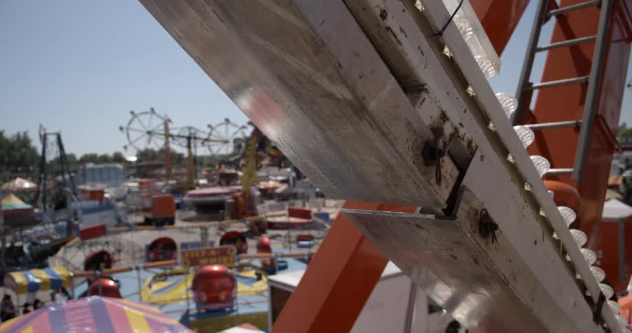 A carnival has many rides moving