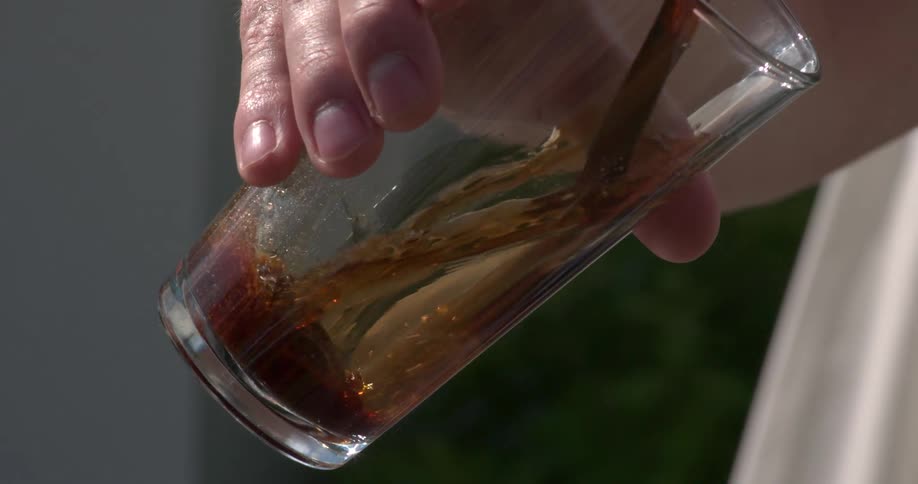 Beer flowing into a glass from a tap