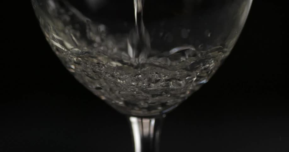 Water pours into a glass
