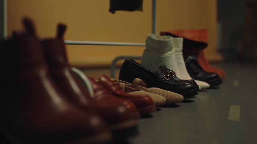 Some shoes and boots next to each other on the floor