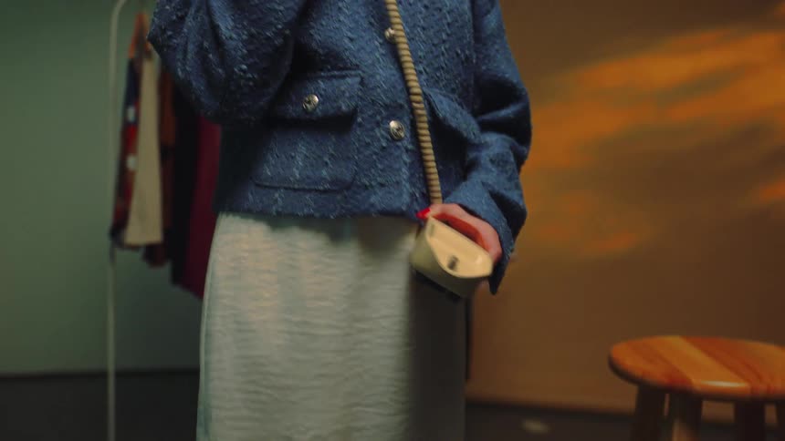 A woman is talking on the telephone