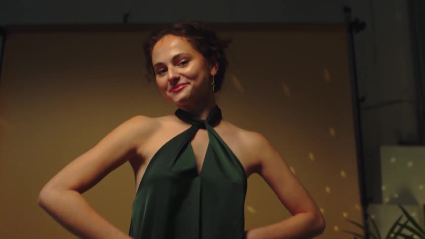 A woman posing in a party dress