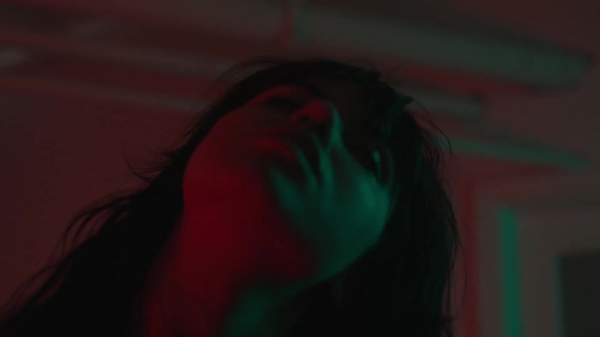 Closeup of a young womans face dancing