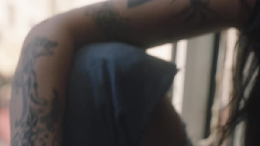 Closeup of a smiling womans face sitting at the window