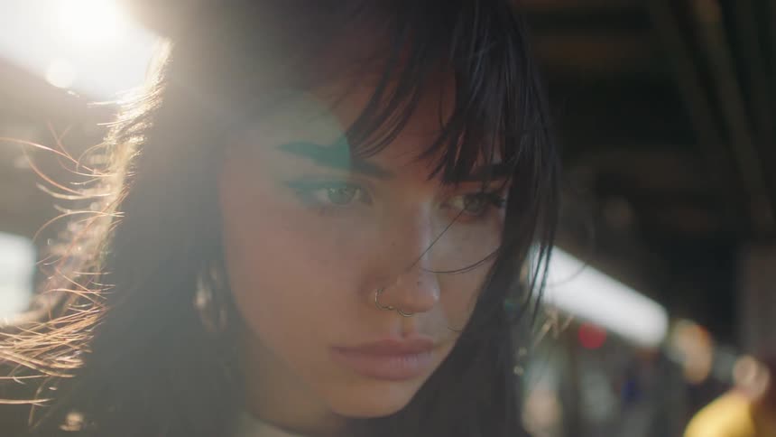 Closeup of a young womans face with nose piercing