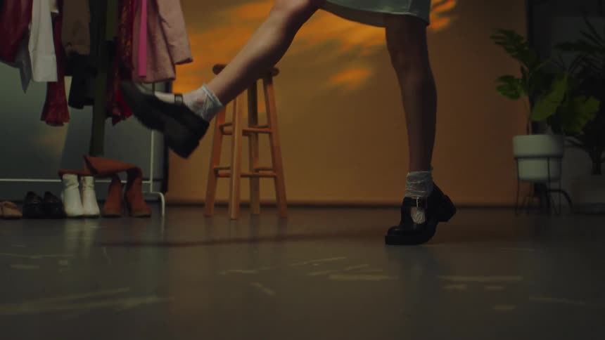 A person wearing high heels walking in a room