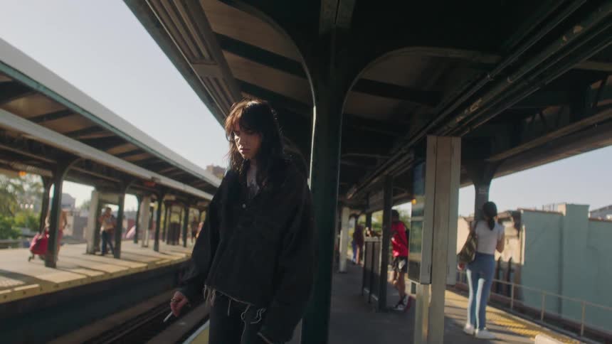 Impatient young woman smokes in the subway station