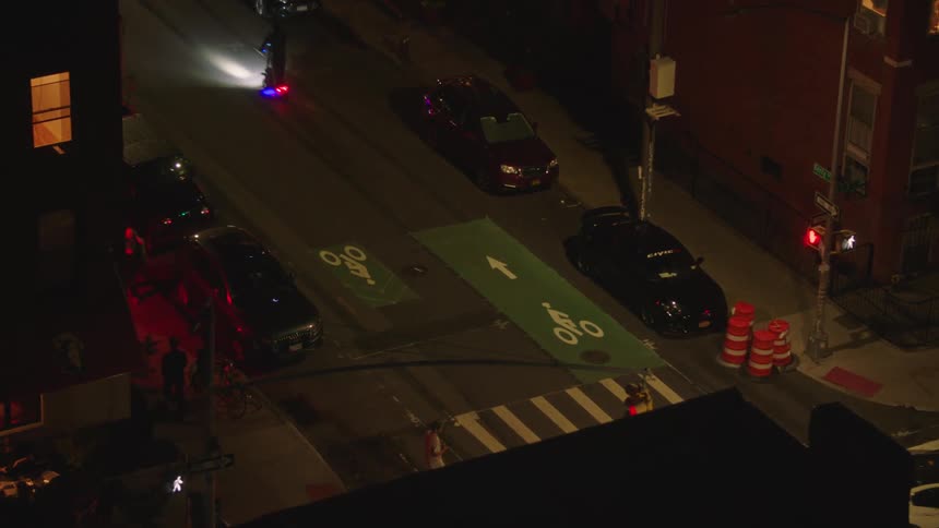 Vehicles on a city street at night