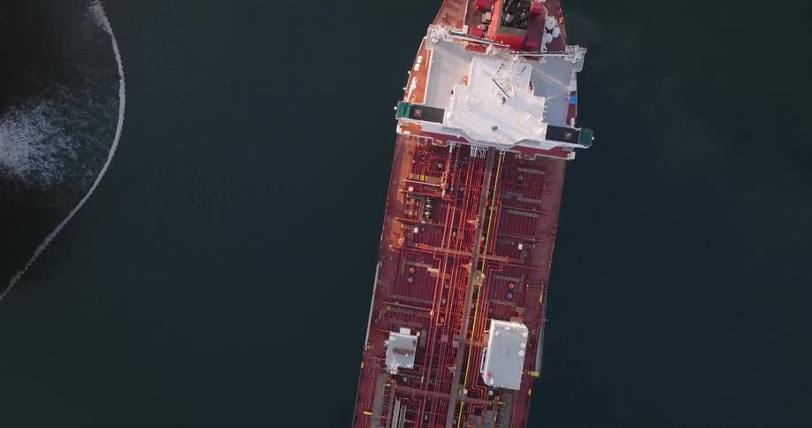 Aerial of a cargo ship sailing across the ocean