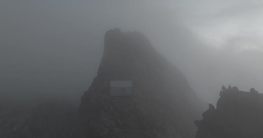 Aerial view of rock formation through mist fog