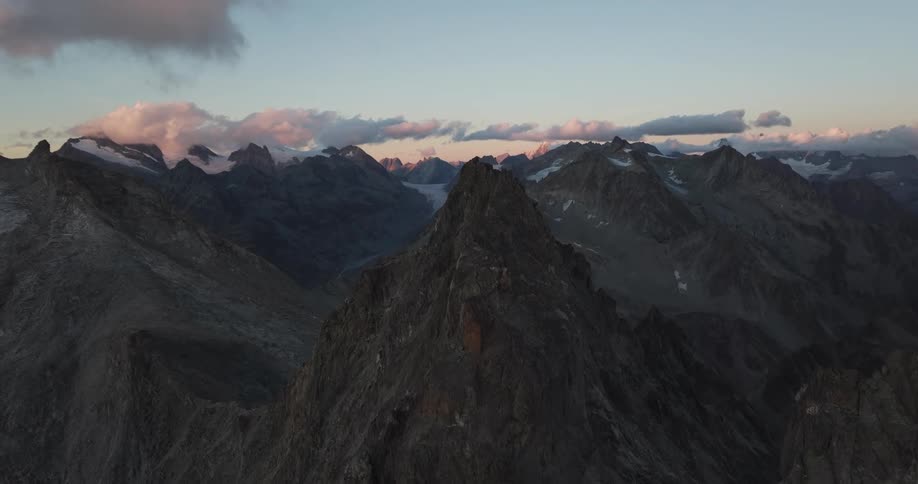 Aerial panorama of peaks and mountains in a morning sky