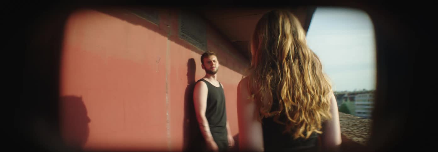 Couple arguing on the balcony of a building