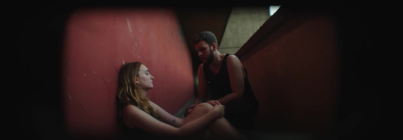 A man is talking to a woman