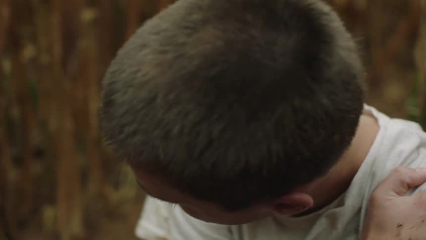 A injured child gets up from the ground