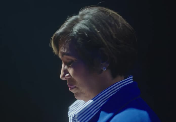 Female adult giving a speech indoors