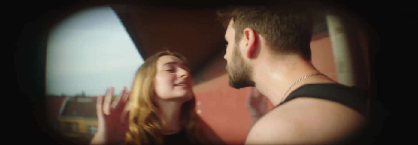 Couple arguing in a hallway of a building