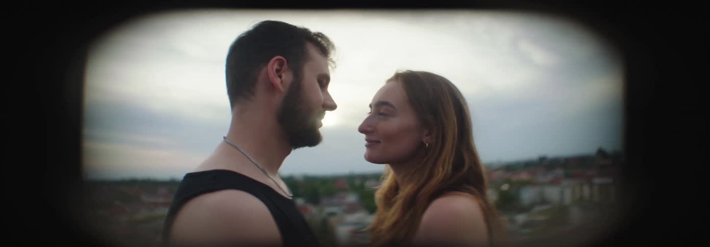 Couple looking at each other and conversing romantically