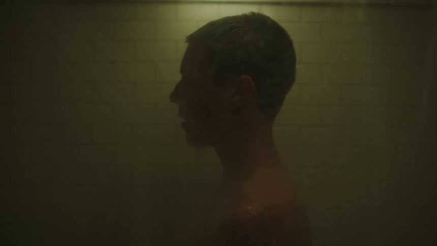 A teenager is taking a shower