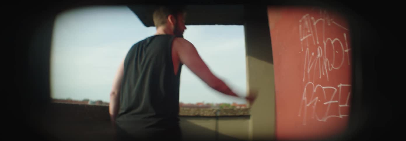 A couple fighting on the balcony of a building