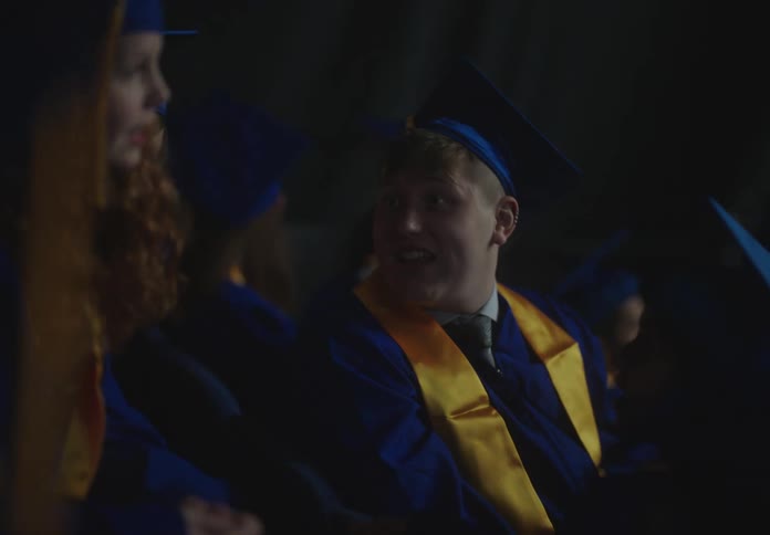 Students are talking at their graduation ceremony