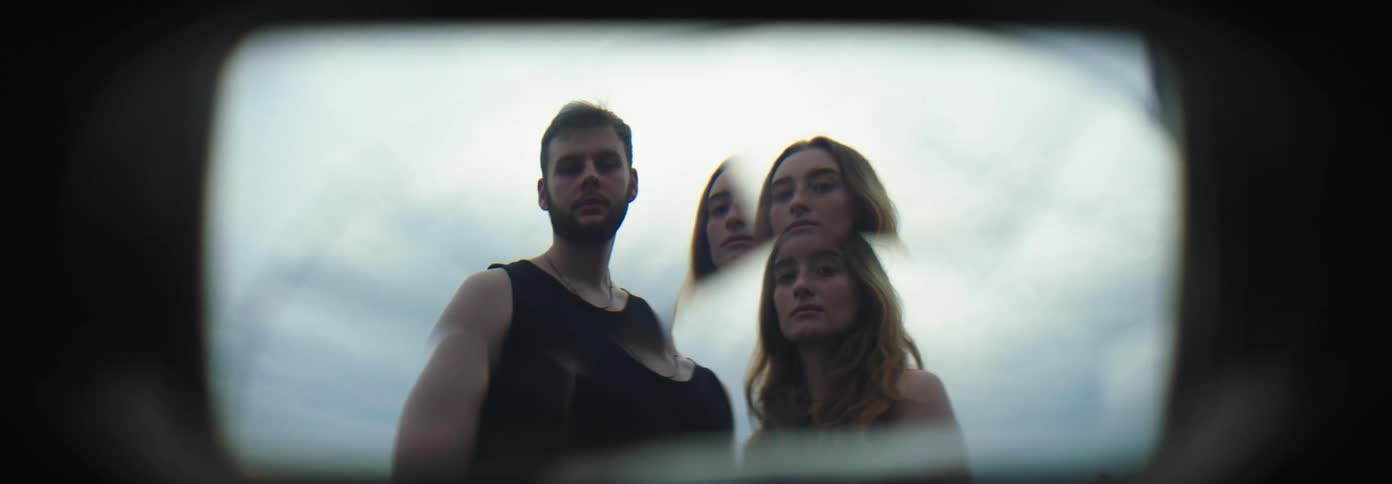 Portrait of a couple side by side through a camera lens