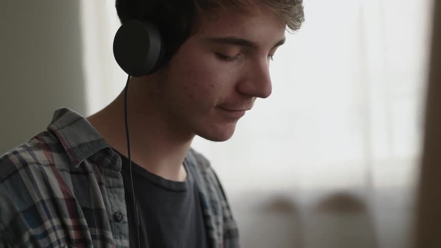 A man is listening to headphones
