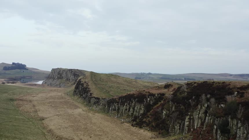 Panorama of a landscape in grassland and plateaus in a natural environment with a cloudy sky