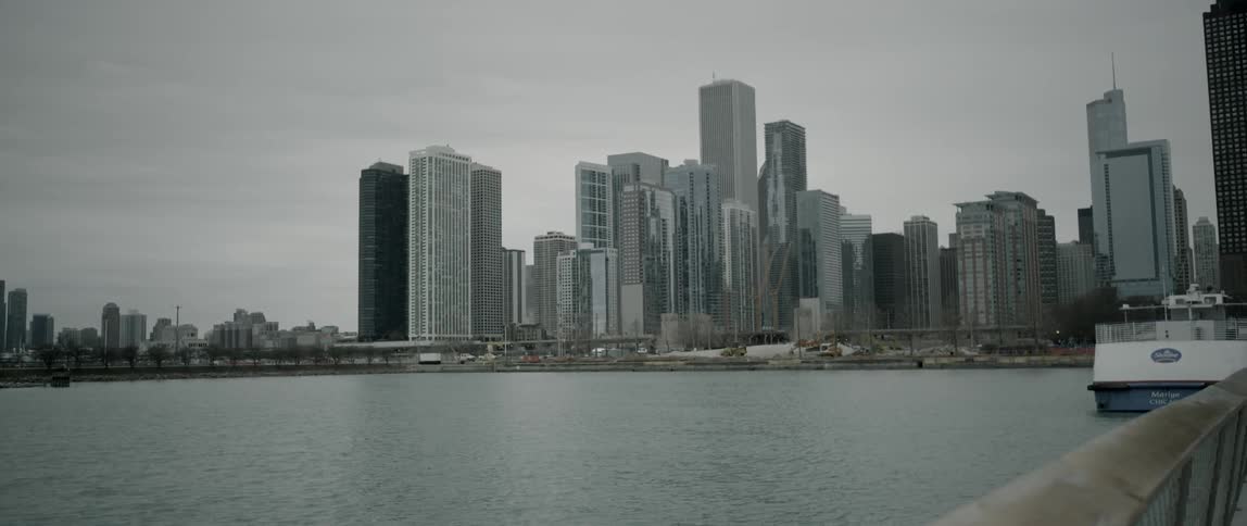 Past the water is a city with tall buildings