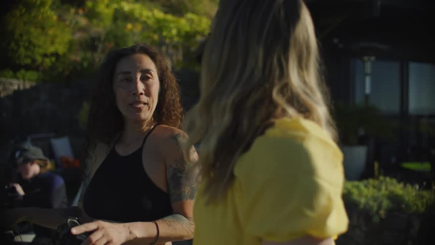 Two friends chatting in an outdoor setting